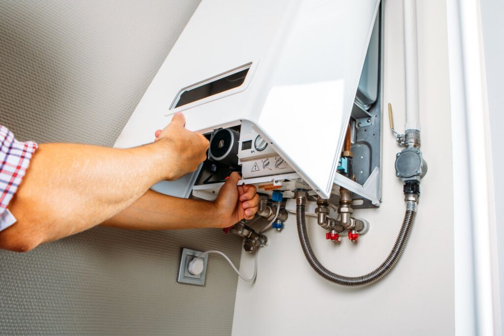 Person working on a boiler