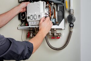 A person working on a boiler