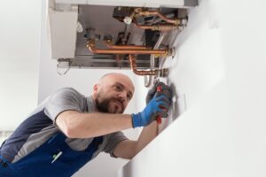 Man working on broiler